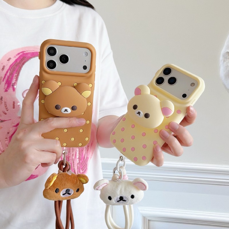 Cute Cartoon Wrist Strap Silicone Case - เคสโทรศัพท์ซิลิโคนลายจุดรูปหมีริลัคคุมะ 3 มิติ พร้อมสายคล้องข้อมือแบบกำมะหยี่ สำหรับ iPhone